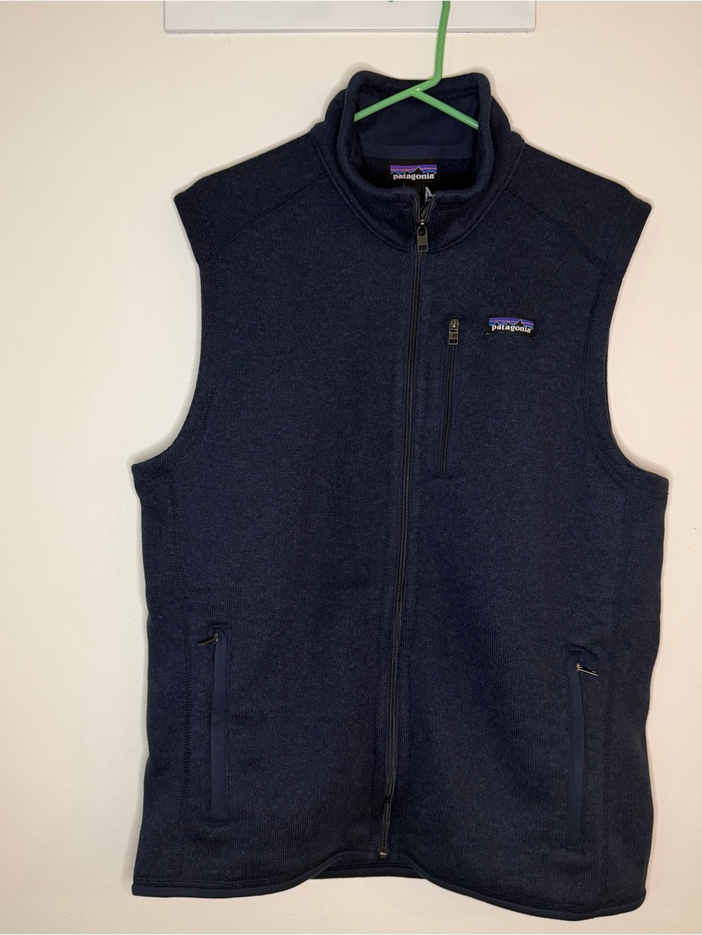 Patagonia Men’s Dark Navy Full-Zip Fleece Vest, with some writing in the back ,L